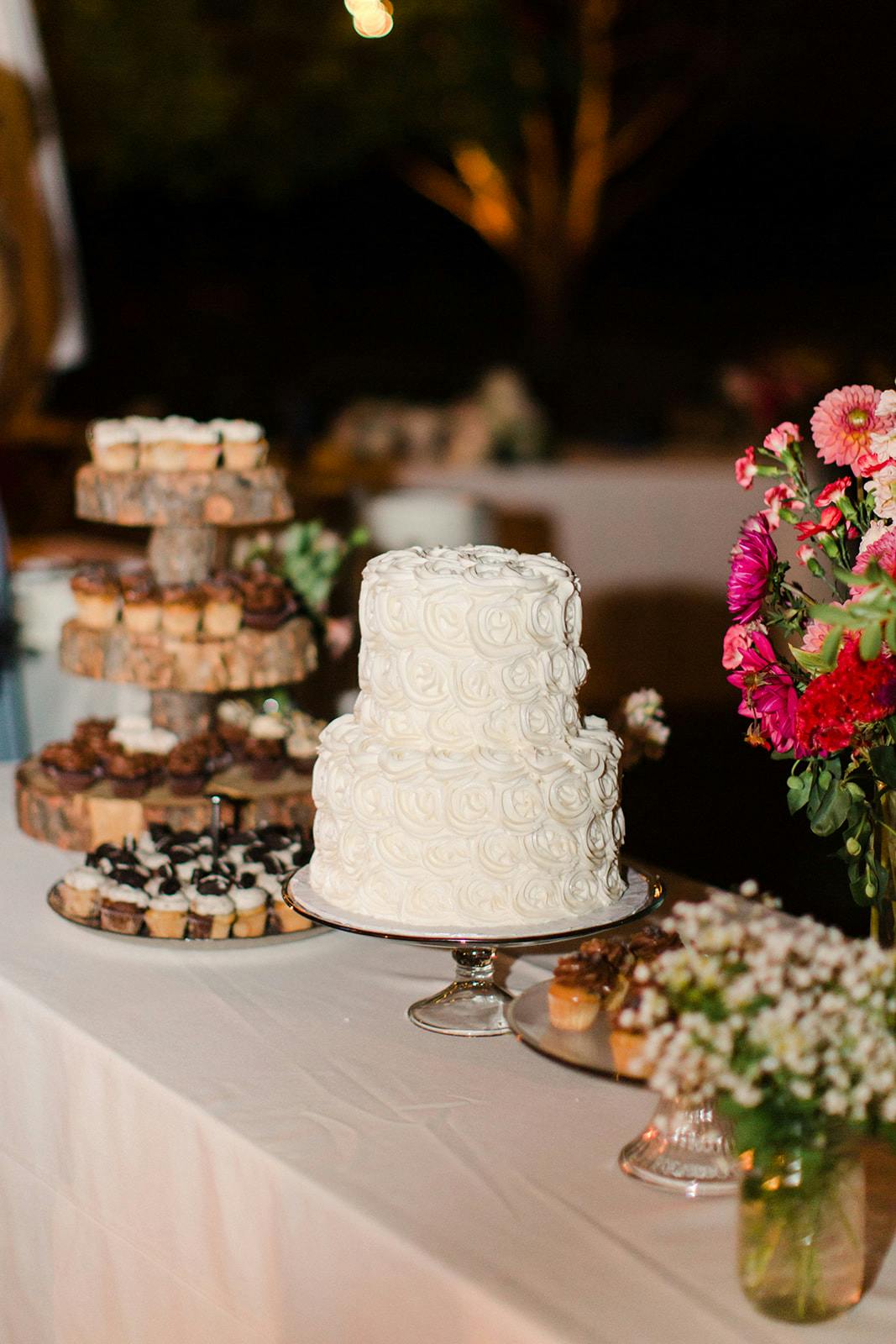 a two tiered white wedding cake